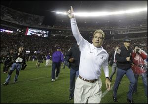 Alabama head coach Nick Saban runs off the field after the second half of an NCAA college football game against LSU on Saturday in Tuscaloosa, Ala.