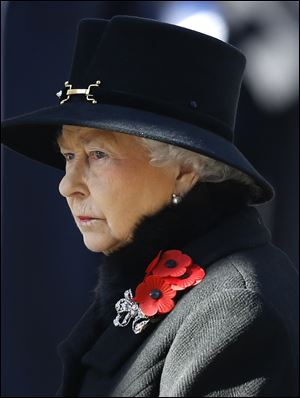 Britain's Queen Elizabeth II listens during the service of remembrance today at the Cenotaph in Whitehall, London.