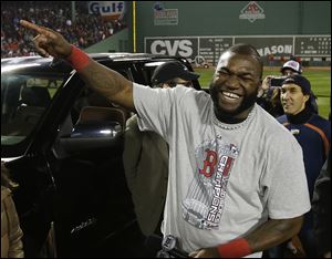 Boston Red Sox designated hitter David Ortiz laughs after being named the MVP after Game 6 of baseball's World Series, in Boston, on Oct. 31.
