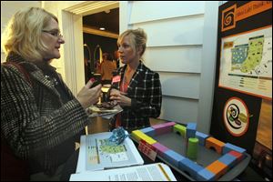 Cathy Sheets, left, speaks with Sloan Mann, assistant director of S.T.E.M. education for the Imagination Station, about the Idea Lab. It is to be an interactive exhibit with space for a workshop.