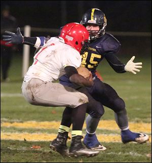 Whiteford senior Troy Diller moves in on Detroit Allen’s Tavierre Thomas. Diller leads the Bobcats with 56 tackles. On offense he is the team’s top reciever with 24 catches for 417 yards and four touchdowns.