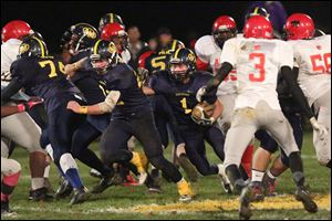 Whiteford senior Colin Lake runs against Detroit Allen. Lake leads the Bobcats with 686 yards rushing on 109 carries.
