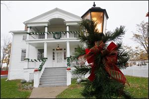 The Wolcott House dons its gay apparel for holiday visitors at the historic home in Maumee.