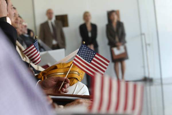 New-citizens-wave-their-American-flags