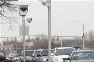 Toledo has been using red-light cameras since 2001 and wants to prevent a state ban on their use.