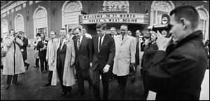 This Nov. 22, 1963, file photo shows President John F. Kennedy, center, and Vice President Lyndon Johnson, in light-colored coat behind Mr. Kennedy, in Fort Worth, from where they left for Dallas.