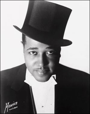Duke Ellington, composer, orchestra leader, and jazz pianist, is seen in a publicity photograph of 1933. Ellington was born April 29, 1899, and died in 1974.