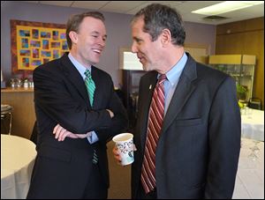 Ed FitzGerald, Cuyahoga County executive and Democratic candidate for governor, left, and U.S. Sen. Sherrod Brown (D., Ohio), chat after Mr. Brown endorsed him during a visit to Toledo.