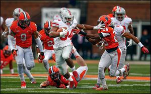 Carlos Hyde stiff-arms Jaylen Dunlap of Illinois on a 51-yard scoring run. Hyde scored five TDs and has 947 yards rushing this season.