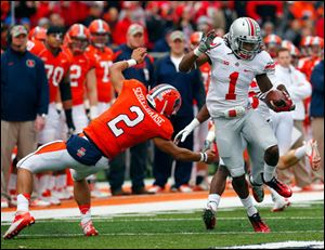 Ohio State cornerback Bradley Roby (1) avoids Illinois quarterback Nathan Scheelhaase (2) as he returns an interception a 63-yards for a touchdown during the first half.