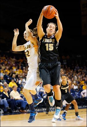 University of Toledo player Ana Capotosto (32) loses a rebound to Purdue University player Courtney Moses (15) during the first half.