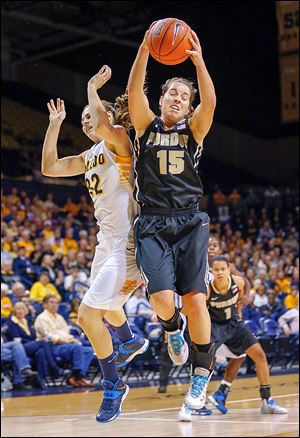 Toledo's Ana Capotosto (32) loses a rebound to Purdue's Courtney Moses during the first half. Key errors hurt the Rockets' chances to pull an upset.