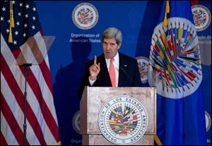 Secretary of State John Kerry gestures as he speaks at the Organization of American States (OAS) in Washington.