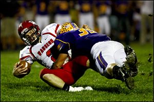 Wauseon quarterback Ty Suntken is sacked by Bryan linebacker Jake Jones. Jones leads the team in tackles this season. The Golden Bears won the NWOAL title for the second straight year.