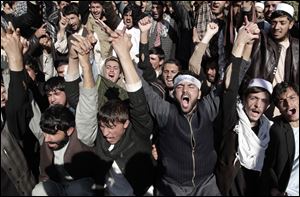 Afghan students shout anti-government and U.S. slogans as they protest against the upcoming Loya Jirga, a traditional means of consultations, in Jalalabad, eastern Afghanistan, Tuesday.