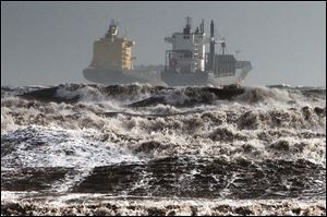 Two tankers are battered by gale winds while at the roadstead in the rough waters of the Gulf of Cagliari, Sardinia.