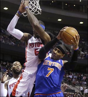 New York Knicks forward Carmelo Anthony (7) is blocked by Detroit Pistons forward Josh Smith (6) during the first half of an NBA basketball game in Auburn Hills, Mich., Tuesday, Nov. 19, 2013. (AP Photo/Carlos Osorio)
