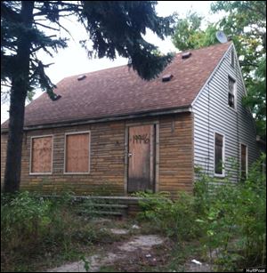 Eminem's childhood home in Detroit, Mich., as pictured on his album covers.