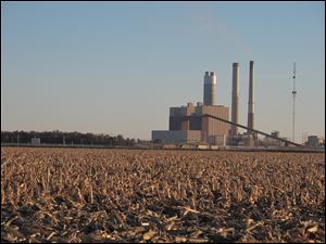Ameren Corp.’s power plant rises from beyond a freshly harvested cornfield outside Newton, Ill., population 2,850. Newton residents fear environmental regulations could force its closing.