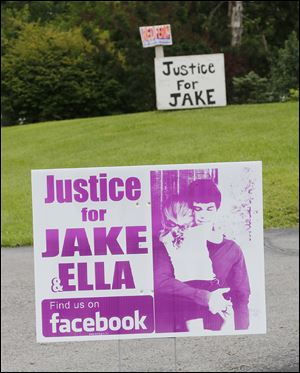 'Justice for JAKE' signs along State Rt. 269 in Castalia were part of a campaign by the Jacob Limberios family. He died in March, 2012, of a gunshot wound to the head, now ruled accidental. 