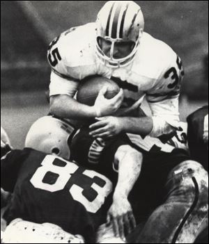 Fullback Jim Otis dives over the Iowa line to score a touchdown in 1968 in an Ohio State victory that was part of a 22-game winning streak from 1967-69. The Buckeyes won the 1968 national title.