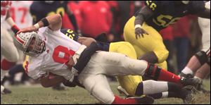 Ohio State Stanley Jackson is sacked by Michigan’s Dhani Jones. Jackson, an OSU quarterback in the 1990s will be a special guest at the Blanchard Avenue Pentecostal Church of God.