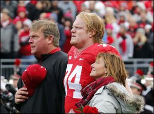 Mewhort with his parents on Senior Day.