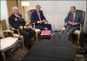From left, U.S. Navy Vice Admiral Kurt Tidd, U.S. Secretary of State John Kerry, and Russian foreign minister Sergei Lavrov meet before talks on Iran’s nuclear program in Geneva.