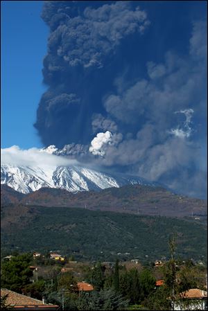 Smoke billows from the Mount Etna, Europe's tallest active volcano, Sicily today.