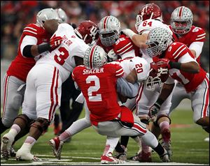 Ohio State’s Ryan Shazier stops D'Angelo Roberts. Indiana was held scoreless until the fourth quarter.
