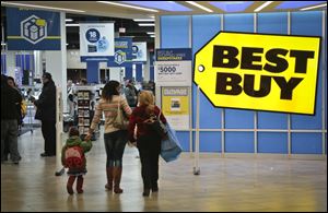 Shoppers enter a  Best Buy Saturday in New York.