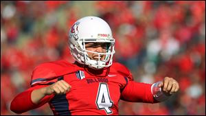 Fresno State quarterback Derek Carr celebrates one of his seven touchdown passes against New Mexico on Saturday in Fresno, Calif.