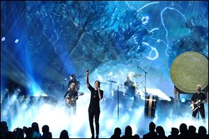 Dan Reynolds of the musical group Imagine Dragons performs during the American Music Awards at the Nokia Theatre in Los Angeles on Sunday. The band was named favorite alternative rock artist.
