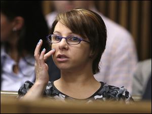 Michelle Knight sits in the courtroom during a break in the sentencing phase for Ariel Castro, in Cleveland in August.