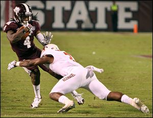 Bowling Green’s Brian Sutton tackles Mississippi State’s Jameon Lewis. Sutton led the Falcons with five tackles last week.
