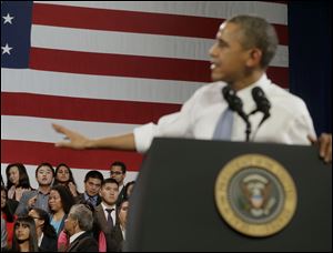 President Barack Obama responds to a heckler during his speech about anti-deportation policies at the Betty Ann Ong Chinese Recreation Center in San Francisco.