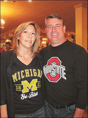 Andrea and Pat Gibbons root for opposing teams.  