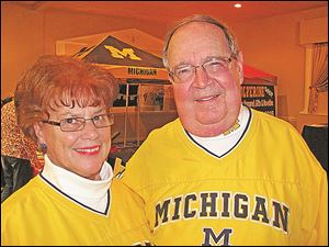 John and Ruth Mizerek, Mich. fans, have had tickets to the big OS/Mich game for 35 yrs. but this year they decided to watch everything on television and let the younger folks tend to the tailgating at the game. 