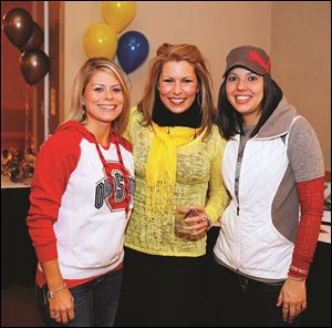 Left to right Allison Hammons, Cheryl Hardy, and Sheri Bokros during the Epilepsy Center tailgate party.