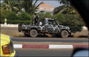 A Malian military vehicle guards the vicinity of the house of Gen. Amadou Haya Sanogo in Bamako, Mali