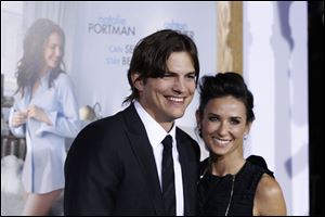Ashton Kutcher, left, and Demi Moore at the premiere for 