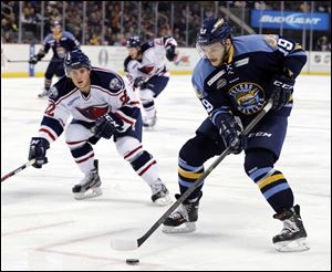 Walleye's Martin Frk (19) moves the puck against South Carolina during an ECHL hockey game Wednesday.