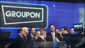 Andrew Mason, founder and chief executive of Groupon, attends his company’s IPO in New York. Groupon, the company that pioneered online group discounts, saw its stock climb nearly a third in its public debut in 2011, but the company’s share price has been cut by half in the past two years.