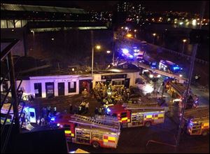 The helicopter crash at the Clutha Bar in Glasgow Friday. The police helicopter crashed late Friday night into the roof of a popular pub in Glasgow, Scotland, leaving the building littered with debris and emergency crews scrambling to the scene.