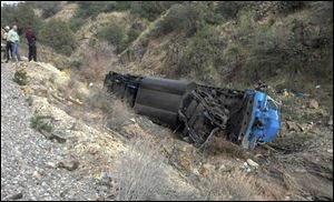 This Nov. 30, 2013 photo provided by the New Mexico State Police shows a train derailment in Grant County in southern N.M.