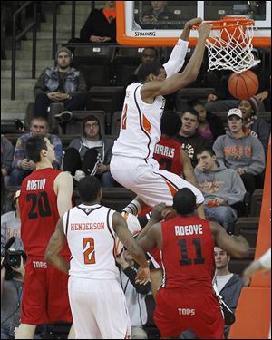 BG's Richaun Holmes dunks in the second half at the Stroh Center. He scored 18 points for the Falcons.