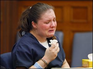 Angela Steinfurth, mother of Elaina Steinfurth, breaks down during her hearing in Lucas County Common Pleas Court.  Attorneys entered an Alford plea on her behalf and she was sentenced Tuesday for murder.