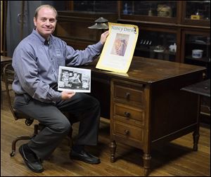  Jade Montrie of Montrie Auction & Estate Service sits at the desk of Mildred Wirt Benson, author of the Nancy Drew mysteries. The desk and other items are from the estate of Margaret ‘Peggy’ Wirt, daughter of Mrs. Benson’s daughter. The items will be auctioned off Sunday.
