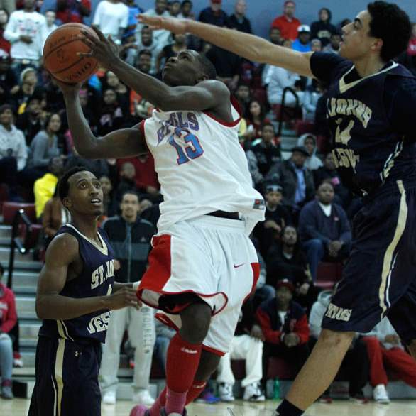 Bowsher-s-Dajuan-King-drives-between-St-John-s-defenders