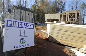 Workers frame a home under construction in Matthews, N.C..